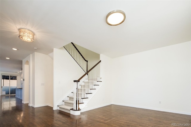 stairway featuring hardwood / wood-style flooring