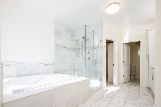 bathroom featuring separate shower and tub