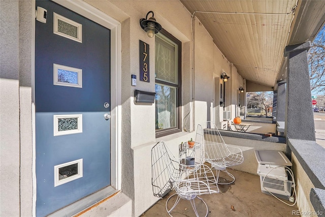 property entrance with covered porch