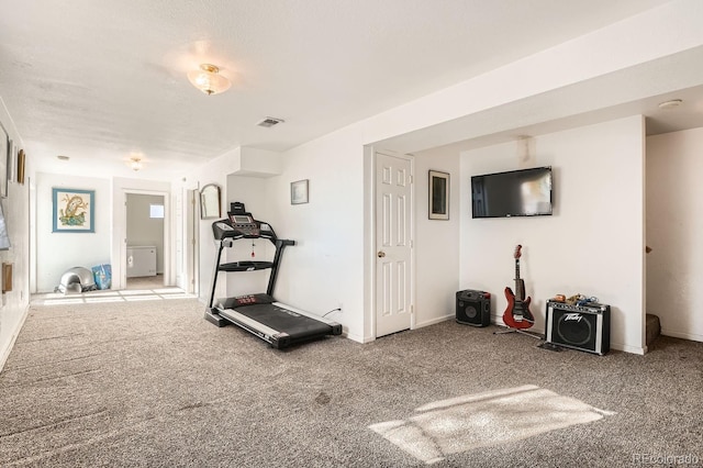 exercise room featuring carpet flooring