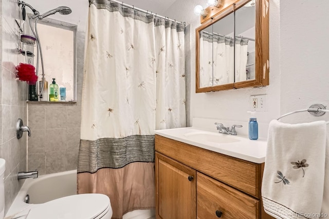 full bathroom featuring shower / tub combo, vanity, and toilet