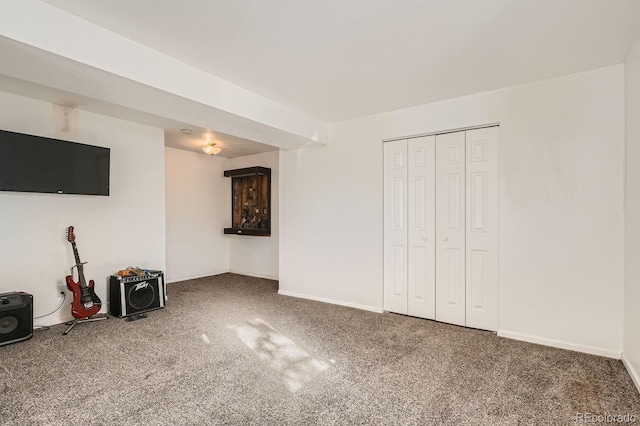 unfurnished living room featuring carpet floors