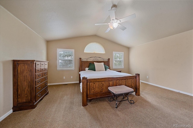 carpeted bedroom featuring ceiling fan and vaulted ceiling