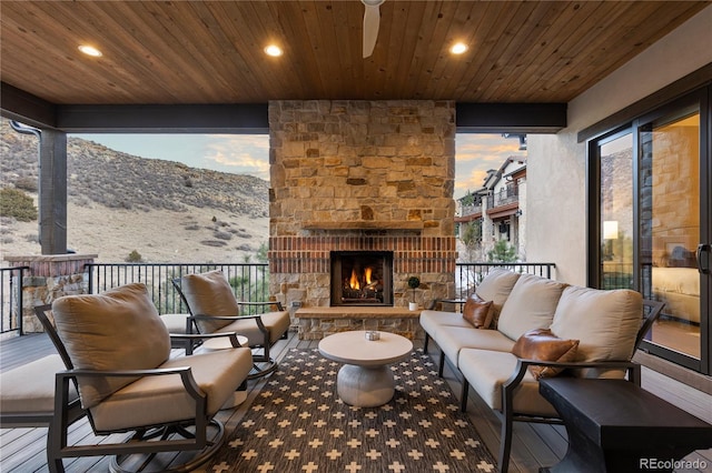 exterior space with an outdoor living space with a fireplace