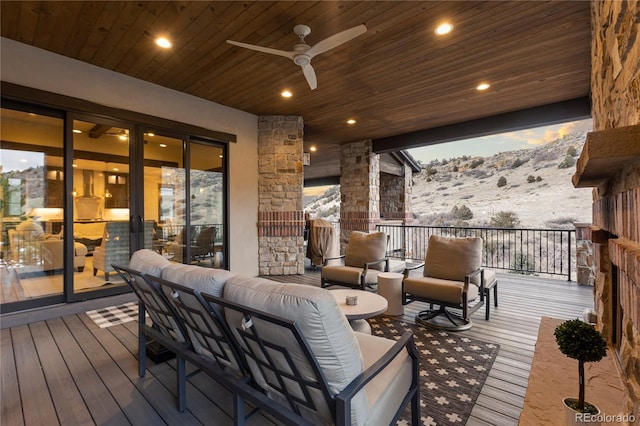 wooden deck featuring a ceiling fan