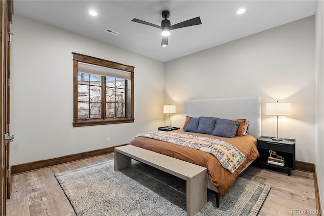 bedroom with recessed lighting, light wood-type flooring, visible vents, and baseboards