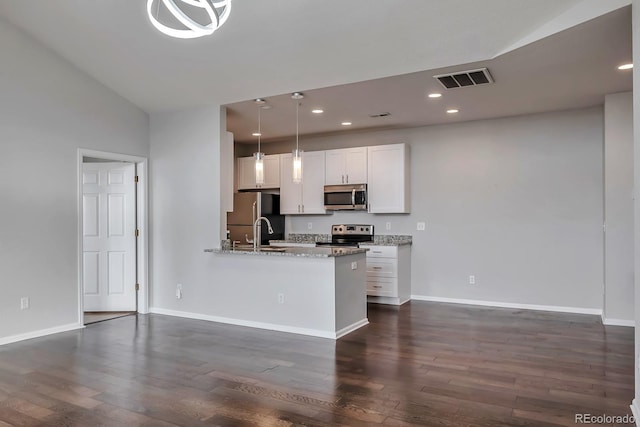 14251 E 1st Dr Unit 308, Aurora, CO 80011 - kitchen with stainless steel appliances, dark wood-type flooring, white cabinets, recessed lighting, and baseboards