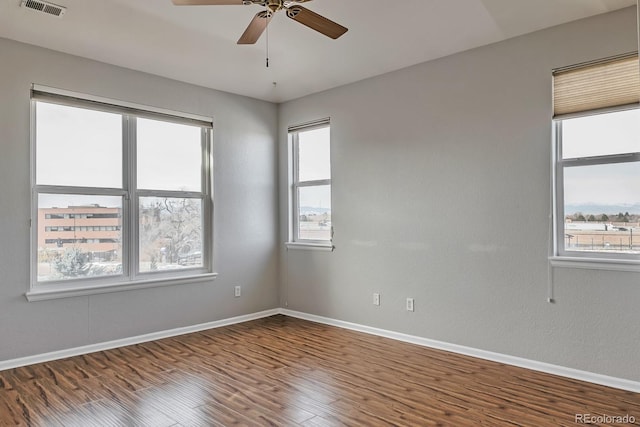 14251 E 1st Dr Unit 308, Aurora, CO 80011 - unfurnished room featuring baseboards, a ceiling fan, and wood finished floors