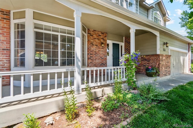5625 W 109th Cir, Westminster, CO 80020 - doorway to property featuring brick siding and a porch