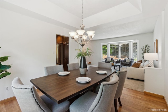 5625 W 109th Cir, Westminster, CO 80020 - dining space featuring a chandelier and light wood-type flooring