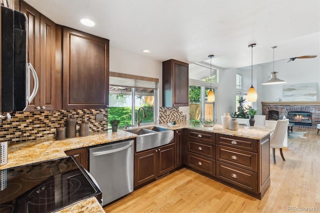 5625 W 109th Cir, Westminster, CO 80020 - kitchen featuring dishwasher, decorative backsplash, light wood-style flooring, dark brown cabinets, and recessed lighting