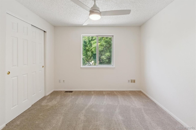 5625 W 109th Cir, Westminster, CO 80020 - unfurnished bedroom with carpet floors, a textured ceiling, a closet, and a ceiling fan