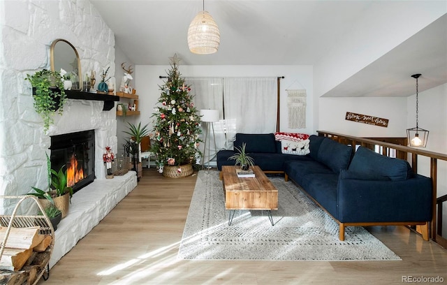 living room with a fireplace and light hardwood / wood-style floors