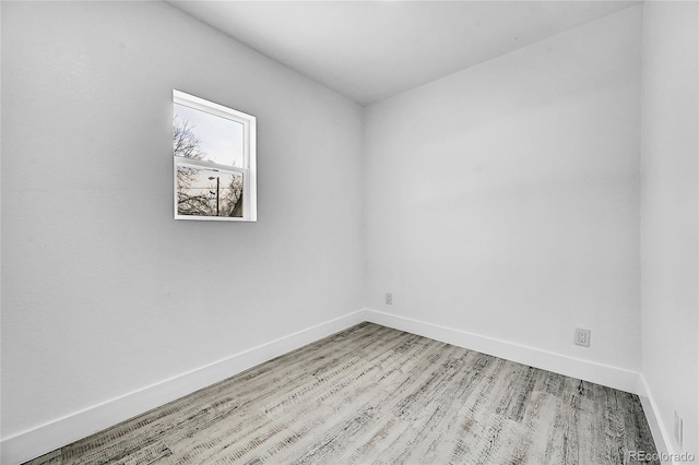 empty room with light hardwood / wood-style floors