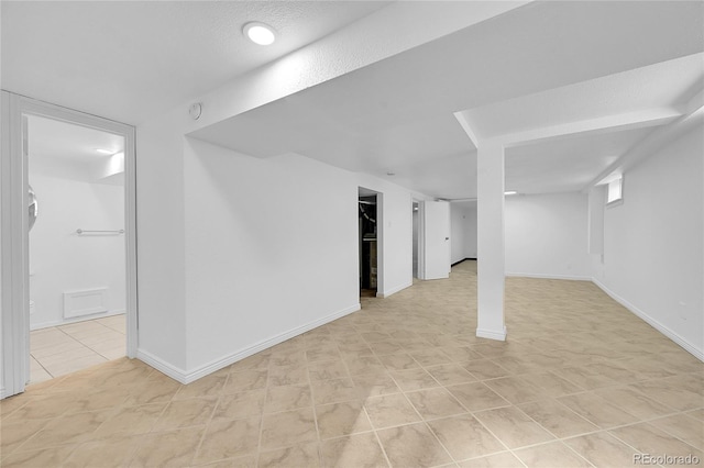 basement with light tile patterned floors