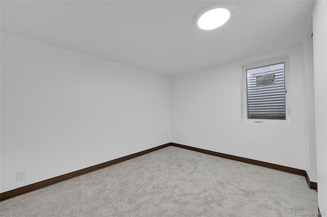 empty room with light colored carpet