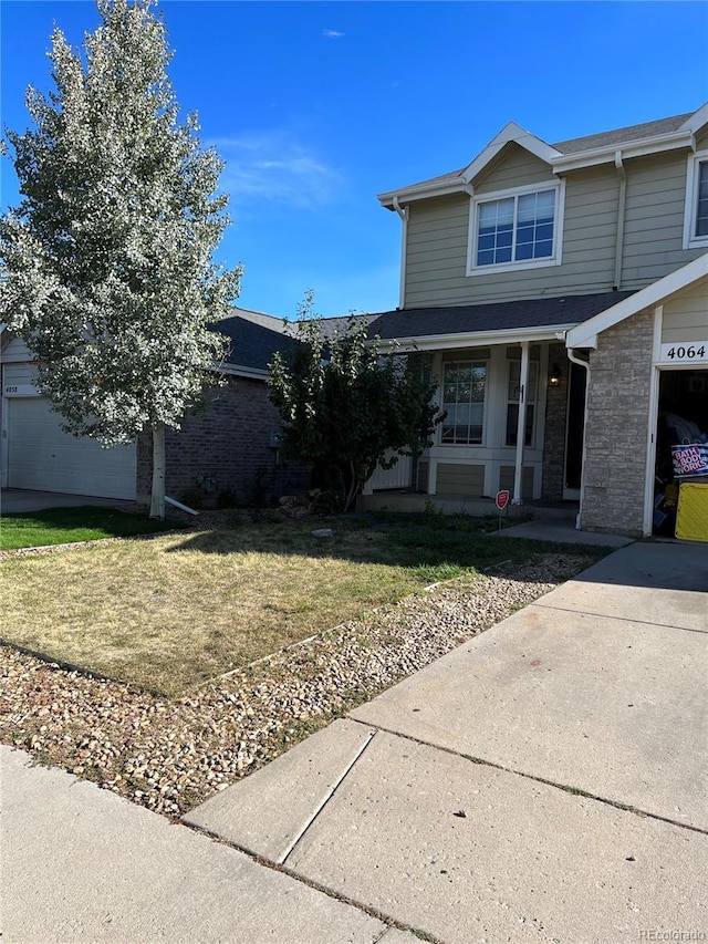 view of front facade with a garage and a front yard