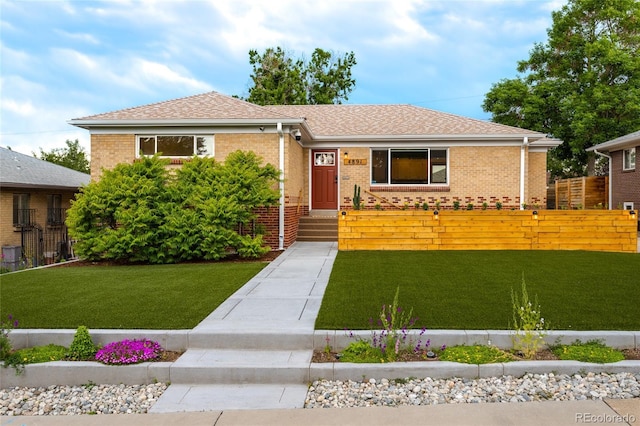 4891 Depew St, Denver, CO 80212 - view of front of home featuring brick siding and a shingled roof