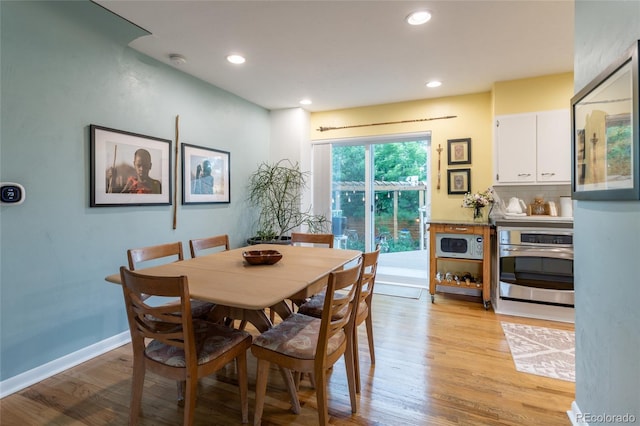 4891 Depew St, Denver, CO 80212 - dining area featuring light wood-style flooring and recessed lighting