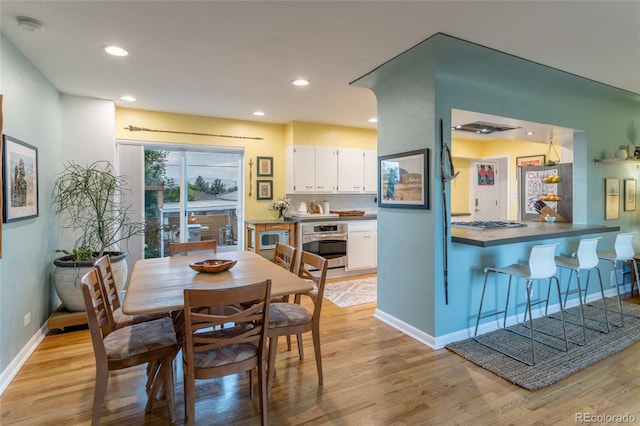 4891 Depew St, Denver, CO 80212 - dining area with light wood-type flooring and recessed lighting