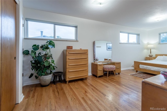 4891 Depew St, Denver, CO 80212 - bedroom featuring arched walkways and light wood-type flooring