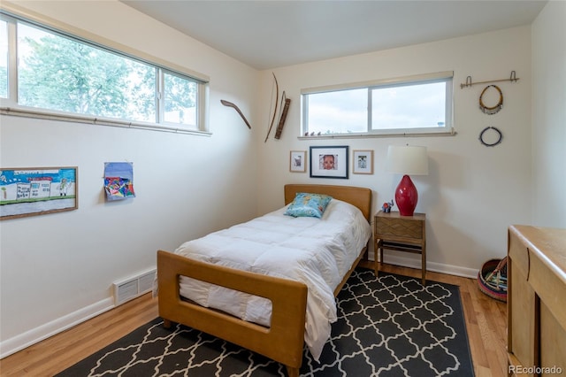 4891 Depew St, Denver, CO 80212 - bedroom featuring wood finished floors