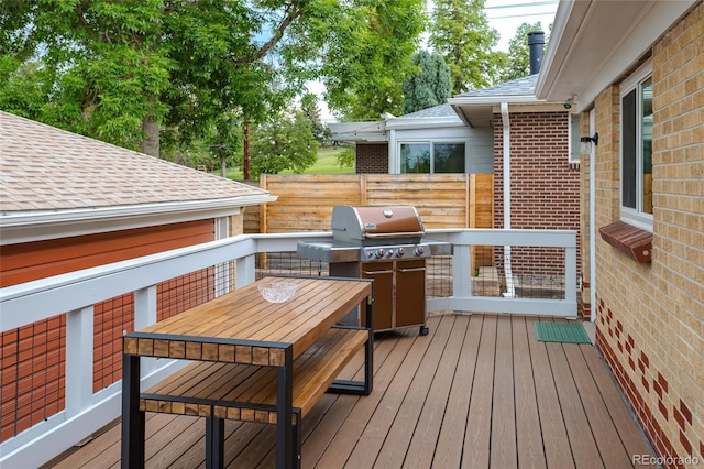 4891 Depew St, Denver, CO 80212 - wooden terrace with area for grilling and outdoor dining space