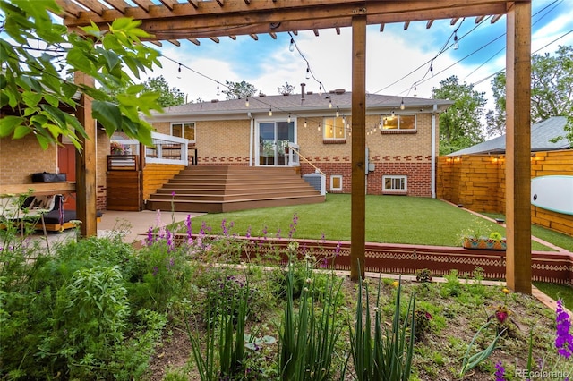 4891 Depew St, Denver, CO 80212 - back of house with brick siding, a deck, a fenced backyard, and stairway