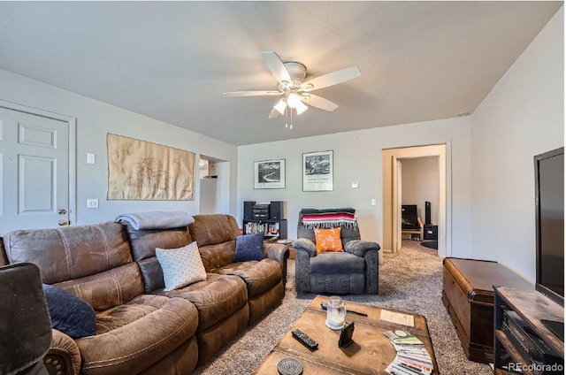 living room featuring carpet and ceiling fan