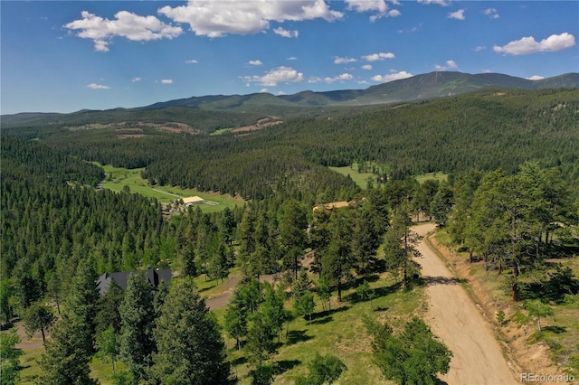7142 Lynx Lair Rd, Evergreen, CO 80439 - aerial view of property and surrounding area with a heavily wooded area and mountains