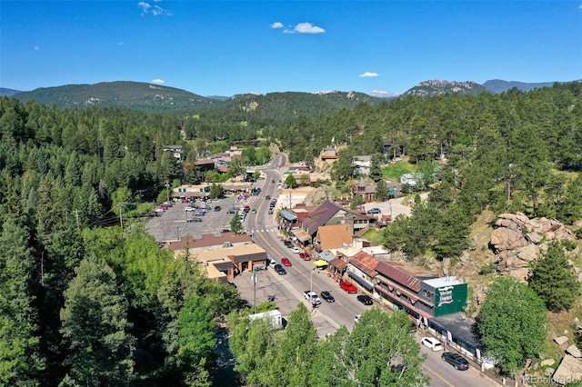 7142 Lynx Lair Rd, Evergreen, CO 80439 - aerial view of property and surrounding area with a heavily wooded area and mountains