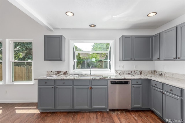 2026 S Pitkin St, Aurora, CO 80013 - kitchen with stainless steel dishwasher, gray cabinets, plenty of natural light, light stone countertops, and recessed lighting