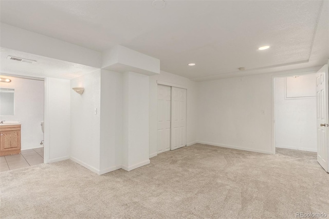 2026 S Pitkin St, Aurora, CO 80013 - finished below grade area featuring light carpet, baseboards, and recessed lighting