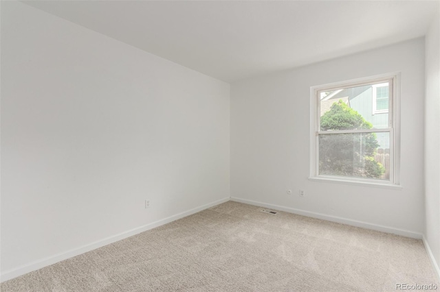 2026 S Pitkin St, Aurora, CO 80013 - empty room featuring baseboards and light carpet