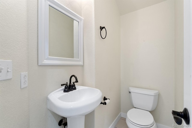 bathroom with toilet and sink