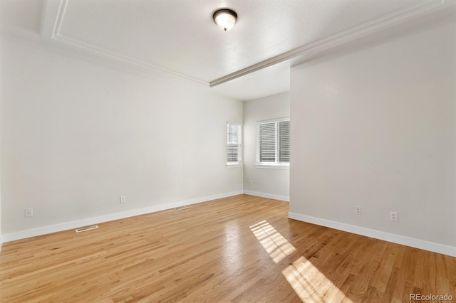 spare room featuring light wood-type flooring