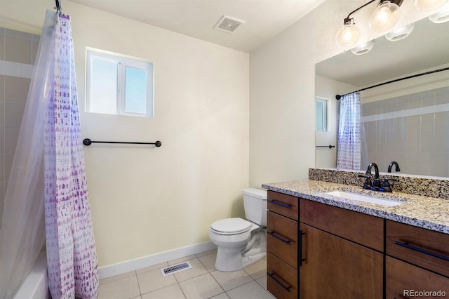 full bathroom featuring tile patterned flooring, vanity, toilet, and shower / tub combo