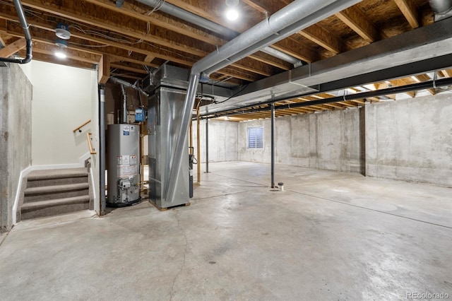 basement featuring heating unit and water heater