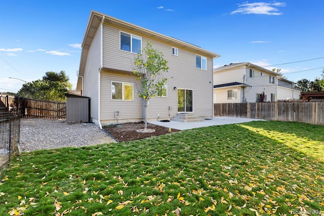 rear view of property with a lawn and a patio area