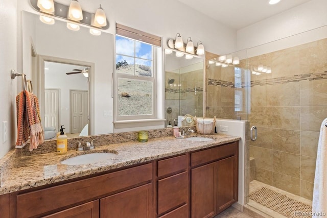 5703 Canyon Reserve Hts, Colorado Springs, CO 80919 - bathroom featuring double vanity, ceiling fan, a sink, and a stall shower