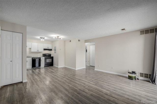 8843 Colorado Blvd Unit 208, Thornton, CO 80229 - unfurnished living room featuring wood finished floors, a textured ceiling, and electric panel