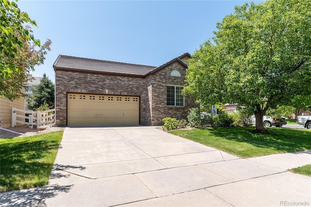 24664 E Louisiana Cir, Aurora, CO 80018 - view of front of home featuring brick siding, concrete driveway, a front lawn, and an attached garage
