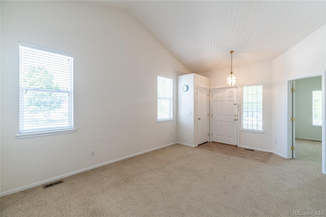 24664 E Louisiana Cir, Aurora, CO 80018 - foyer featuring carpet flooring, vaulted ceiling, and baseboards