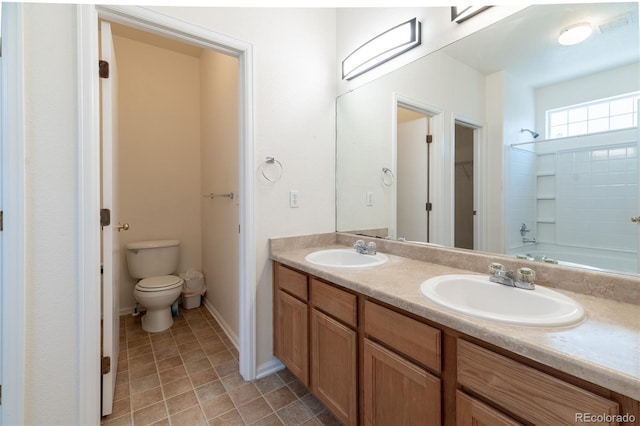 24664 E Louisiana Cir, Aurora, CO 80018 - bathroom featuring toilet, double vanity, shower / bathtub combination, and baseboards
