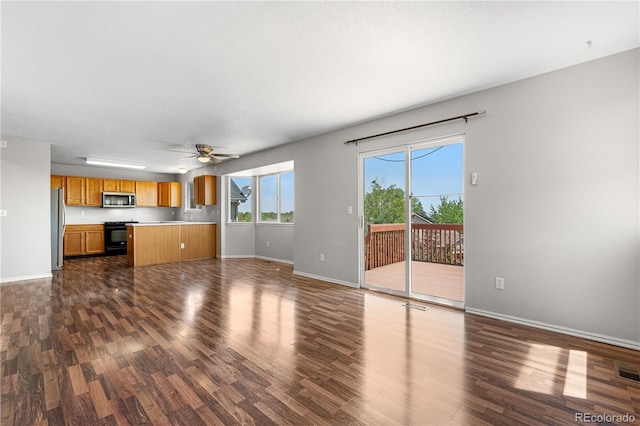 9638 Marion Way, Thornton, CO 80229 - unfurnished living room with dark wood-style floors, baseboards, and a ceiling fan