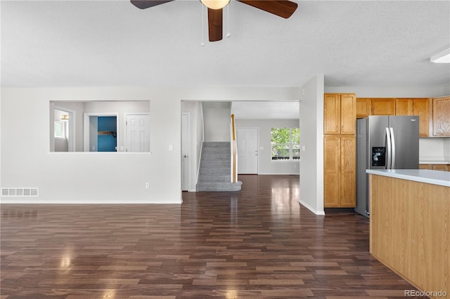 9638 Marion Way, Thornton, CO 80229 - kitchen featuring stainless steel fridge, dark wood-type flooring, a ceiling fan, baseboards, and a textured ceiling