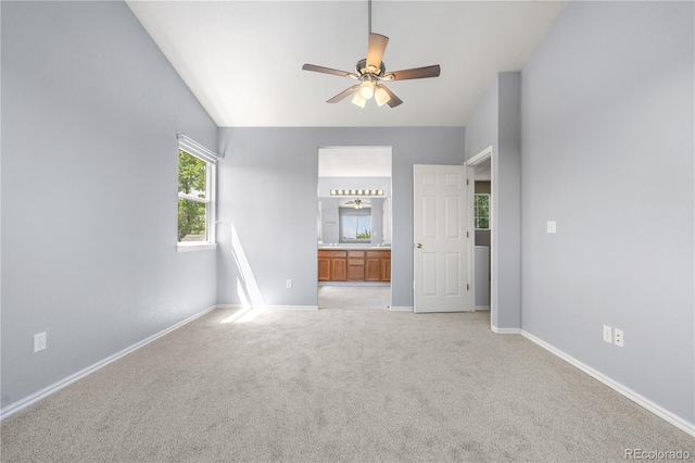 9638 Marion Way, Thornton, CO 80229 - unfurnished bedroom featuring baseboards, light carpet, ensuite bath, and ceiling fan
