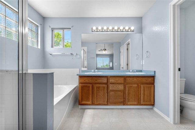 9638 Marion Way, Thornton, CO 80229 - bathroom with toilet, tile patterned flooring, a bath, double vanity, and a shower stall