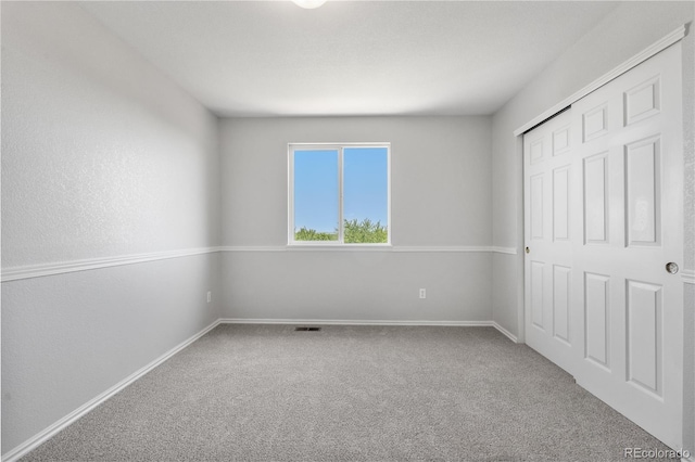 9638 Marion Way, Thornton, CO 80229 - unfurnished bedroom with carpet floors, baseboards, and a closet
