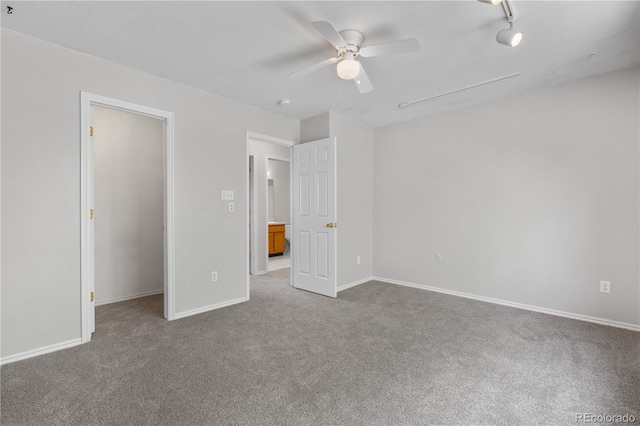 9638 Marion Way, Thornton, CO 80229 - unfurnished bedroom featuring carpet floors, a walk in closet, a ceiling fan, and baseboards